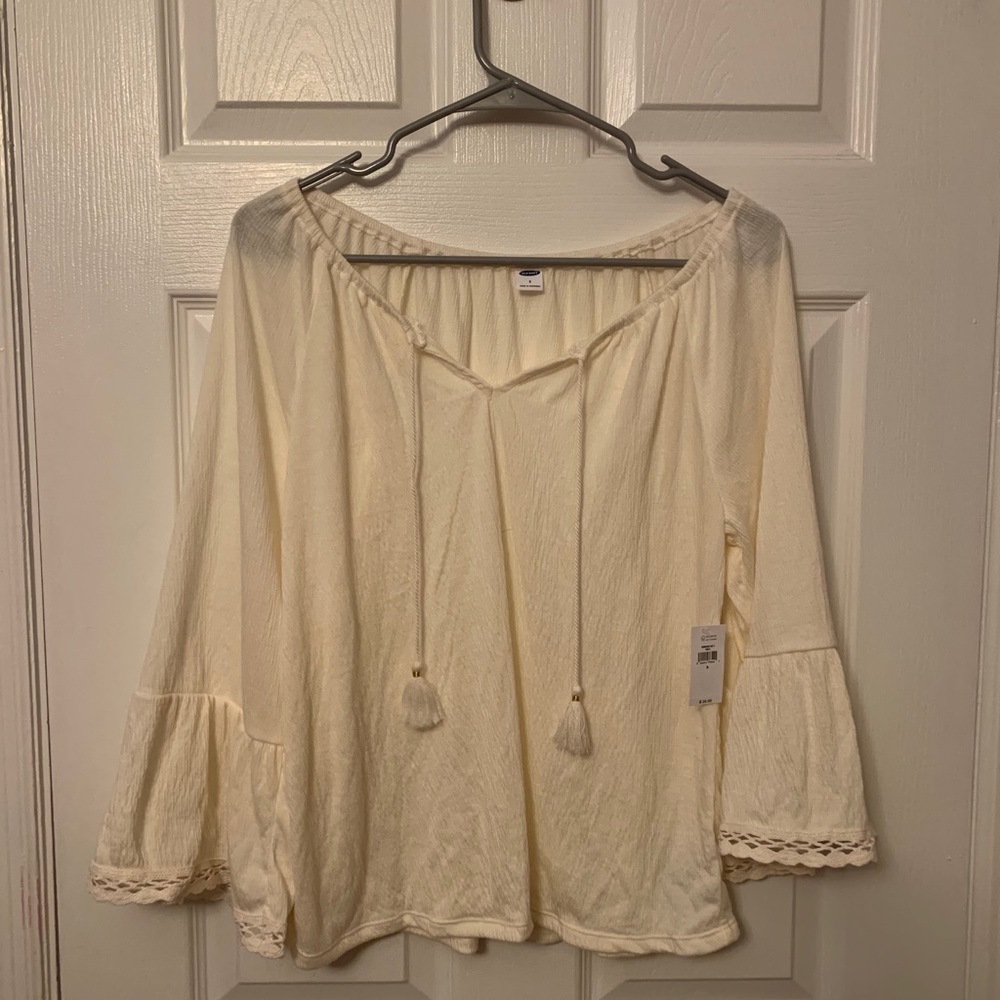 Light creme colored flowy sleeve shirt